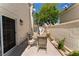 Cozy patio area with a table and chairs for outdoor relaxation at 7945 Delbonita Ave, Las Vegas, NV 89147