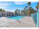 Community pool area with clear blue water surrounded by a secure fence at 7945 Delbonita Ave, Las Vegas, NV 89147