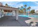 Community pool with a covered seating area, perfect for relaxation at 7945 Delbonita Ave, Las Vegas, NV 89147