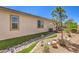 Manicured backyard with rock creek bed and desert landscaping at 797 Drammatico Pl, Henderson, NV 89011