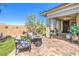 Cozy patio with outdoor furniture and a manicured lawn at 797 Drammatico Pl, Henderson, NV 89011