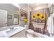 Bathroom with sunflower shower curtain and white vanity at 797 Drammatico Pl, Henderson, NV 89011