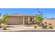 Charming single-story home with manicured lawn, desert landscaping, and a two-car garage at 797 Drammatico Pl, Henderson, NV 89011