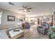 Spacious living space includes a living room, dining room, kitchen, and wood-look floors at 797 Drammatico Pl, Henderson, NV 89011