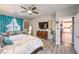 Large main bedroom featuring wood-look floors, natural lighting and access to the ensuite bathroom at 797 Drammatico Pl, Henderson, NV 89011