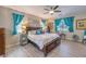 Comfortable main bedroom featuring natural light from two windows and a ceiling fan at 797 Drammatico Pl, Henderson, NV 89011