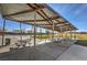 Covered picnic area equipped with tables and benches, offering a shaded space for outdoor gatherings and relaxation at 797 Drammatico Pl, Henderson, NV 89011