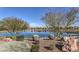 Scenic pond surrounded by lush landscaping, creating a tranquil environment for residents to enjoy nature and outdoor activities at 797 Drammatico Pl, Henderson, NV 89011