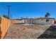 Backyard featuring privacy fence and rear exterior of the home with covered patio at 824 N 20Th St, Las Vegas, NV 89101