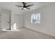 Bright bedroom featuring neutral carpet, a window and double sliding door closet at 824 N 20Th St, Las Vegas, NV 89101