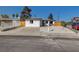 Charming single-story home featuring a well-maintained lawn and front yard with decorative rock at 824 N 20Th St, Las Vegas, NV 89101