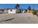 Exterior of a single-story home with a well-maintained lawn and low-maintenance front yard with decorative rock at 824 N 20Th St, Las Vegas, NV 89101