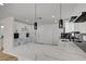 Bright kitchen features white cabinets, granite countertops, and stainless steel appliances at 824 N 20Th St, Las Vegas, NV 89101