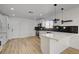 Modern kitchen features white cabinets, quartz countertops, and stainless steel appliances at 824 N 20Th St, Las Vegas, NV 89101
