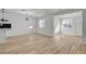 Open living space with wood-look flooring, white walls, and large windows allowing for ample natural light at 824 N 20Th St, Las Vegas, NV 89101