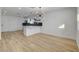 Spacious living area features wood-look floors and access to an open kitchen with white cabinets at 824 N 20Th St, Las Vegas, NV 89101