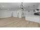 Bright open floor plan with white walls, modern light fixture, and stylish adjacent kitchen at 824 N 20Th St, Las Vegas, NV 89101