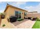 Backyard featuring a patio, seating, and a sliding glass door, creating an inviting outdoor space at 8242 Vino Merlot Ave, Las Vegas, NV 89113