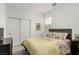 Cozy bedroom featuring a comfortable bed, soft natural light, and closet with sliding doors at 8242 Vino Merlot Ave, Las Vegas, NV 89113