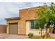 Beautiful single-story home with brick and stone accents, desert landscaping, and an attached one-car garage at 8242 Vino Merlot Ave, Las Vegas, NV 89113