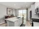 Bright, open kitchen features a large island, stainless steel appliances, and access to the backyard at 8242 Vino Merlot Ave, Las Vegas, NV 89113