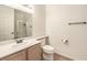 Well-lit bathroom featuring a shower, toilet, and a vanity with a sink at 8408 Running Deer Ave # 201, Las Vegas, NV 89145