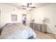 Well-lit bedroom with a double bed, wood-look flooring, and neutral wall colors at 8408 Running Deer Ave # 201, Las Vegas, NV 89145