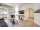 Spacious living room featuring a fireplace, modern furniture, and balcony access at 8408 Running Deer Ave # 201, Las Vegas, NV 89145