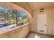 Outdoor patio with a view of the parking area and community landscaping at 8408 Running Deer Ave # 201, Las Vegas, NV 89145