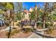 Community entrance sign for Indian Wells, surrounded by lush landscaping at 8408 Running Deer Ave # 201, Las Vegas, NV 89145