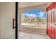 Balcony view featuring the door and overlooking the community with lush desert landscaping at 950 Seven Hills Dr # 124, Henderson, NV 89052