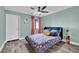 Cozy bedroom with a comfortable bed, ample natural light, and a stylish ceiling fan at 950 Seven Hills Dr # 124, Henderson, NV 89052