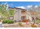 Exterior view of a two story condo with desert landscaping and access to the units at 950 Seven Hills Dr # 124, Henderson, NV 89052