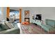 Comfortable living room with a fireplace, complemented by natural light from the balcony at 950 Seven Hills Dr # 124, Henderson, NV 89052