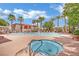 Inviting community pool area with relaxing lounge chairs and a spa at 950 Seven Hills Dr # 124, Henderson, NV 89052