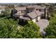 Aerial shot of a large home, boasting a circular tile roof and brick-paved driveways at 9533 Orient Express Ct, Las Vegas, NV 89145