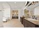 Spacious bathroom featuring dual vanities, a soaking tub, and elegant fixtures at 9533 Orient Express Ct, Las Vegas, NV 89145