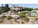 Stunning Tuscan-style villa with manicured landscaping, a pool, and a putting green in a luxurious outdoor setting at 9533 Orient Express Ct, Las Vegas, NV 89145