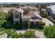Beautiful two story home with tile roof, mature landscaping, and manicured lawns, showcasing its curb appeal at 9533 Orient Express Ct, Las Vegas, NV 89145