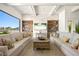 Bright living room features comfortable seating, custom built-ins, and scenic views of the community landscape at 9533 Orient Express Ct, Las Vegas, NV 89145