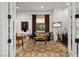 Inviting home office with refined decor, a stylish desk, and views of the landscaped surroundings at 9533 Orient Express Ct, Las Vegas, NV 89145