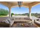 Inviting outdoor patio with comfortable seating, perfect for relaxation and overlooking a tranquil pool at 9533 Orient Express Ct, Las Vegas, NV 89145
