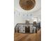 Elegant curved staircase featuring a wrought iron banister and custom ceiling with a decorative medallion at 9533 Orient Express Ct, Las Vegas, NV 89145