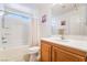 Clean bathroom featuring a bathtub with shower and a vanity at 9785 Iron Mine St, Las Vegas, NV 89183