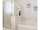 Elegant bathroom features a soaking tub with marble surround and decorative flower vase at 9785 Iron Mine St, Las Vegas, NV 89183