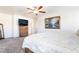 Large primary bedroom with a ceiling fan and stylish furnishings at 9785 Iron Mine St, Las Vegas, NV 89183