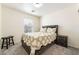Cozy bedroom featuring a comfortable bed with stylish quilt and matching pillows, with carpeted floor at 9785 Iron Mine St, Las Vegas, NV 89183