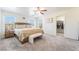 Primary bedroom features a ceiling fan, closet, and a walk in closet at 9785 Iron Mine St, Las Vegas, NV 89183