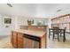 Inviting kitchen featuring a breakfast bar and stainless steel dishwasher at 9785 Iron Mine St, Las Vegas, NV 89183