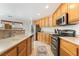 Efficient kitchen featuring stainless steel appliances, laminate counters, and tile flooring at 9785 Iron Mine St, Las Vegas, NV 89183